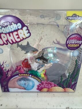 ORB Squisho Sphere Kids Shake and Squish - Clear with Multicolor Accents
